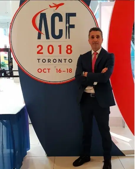 ALS representative beside the ACF 2018 sign at the Air Cargo Forum in Toronto, October 16–18