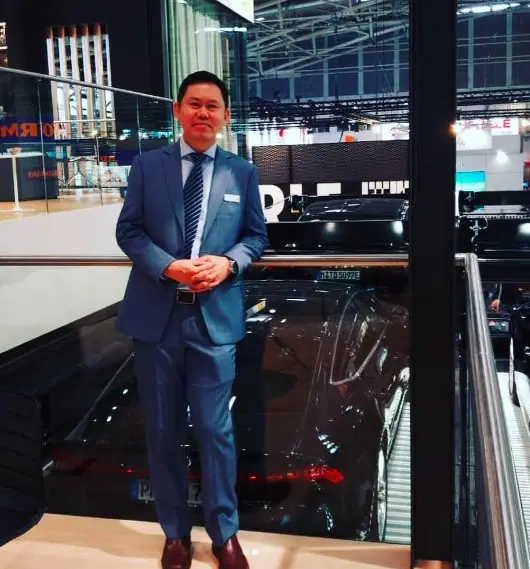 ALS representative above a parked car on an automated car parking system display at BAU 2019