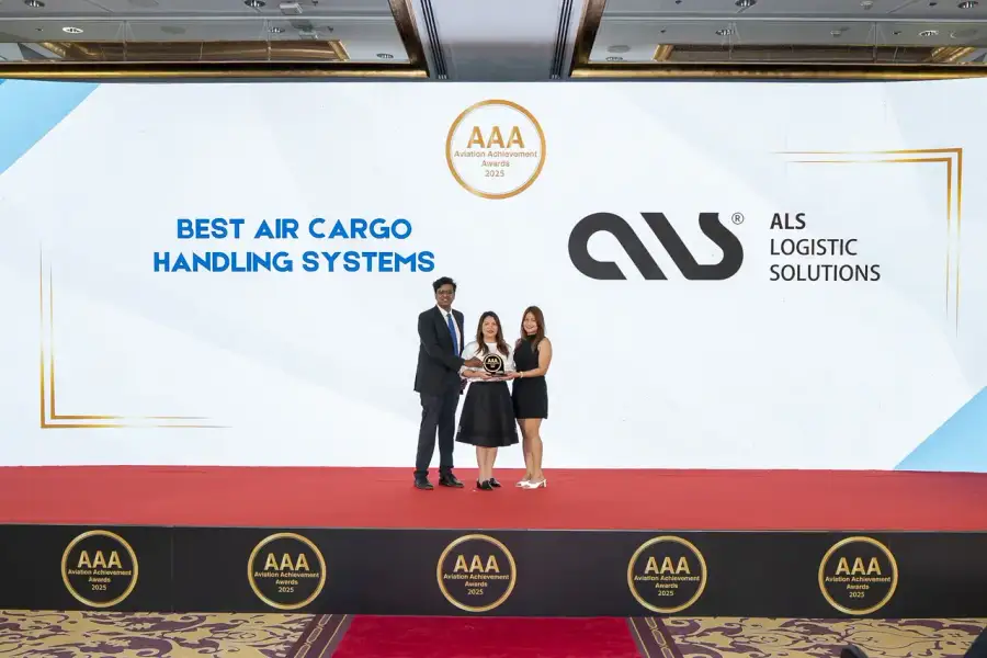 Three ALS team members holding the Best Air Cargo Handling Systems award at the Aviation Achievement Awards 2025