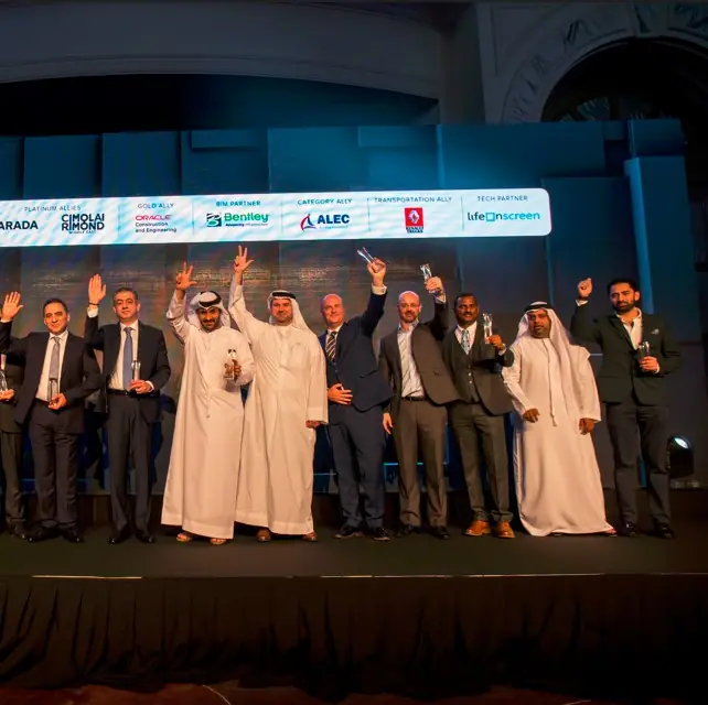 Award winners, including ALS for Most Innovative Technology for Logistics, raising their trophies together on stage