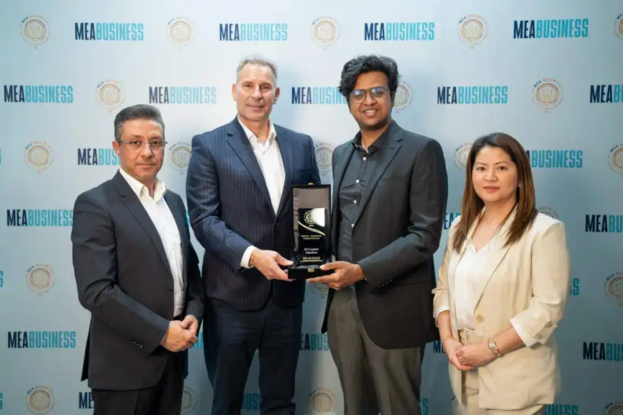 ALS representatives with an award plaque at the MEA Business Technology Achievement Awards 2024 during GITEX Dubai