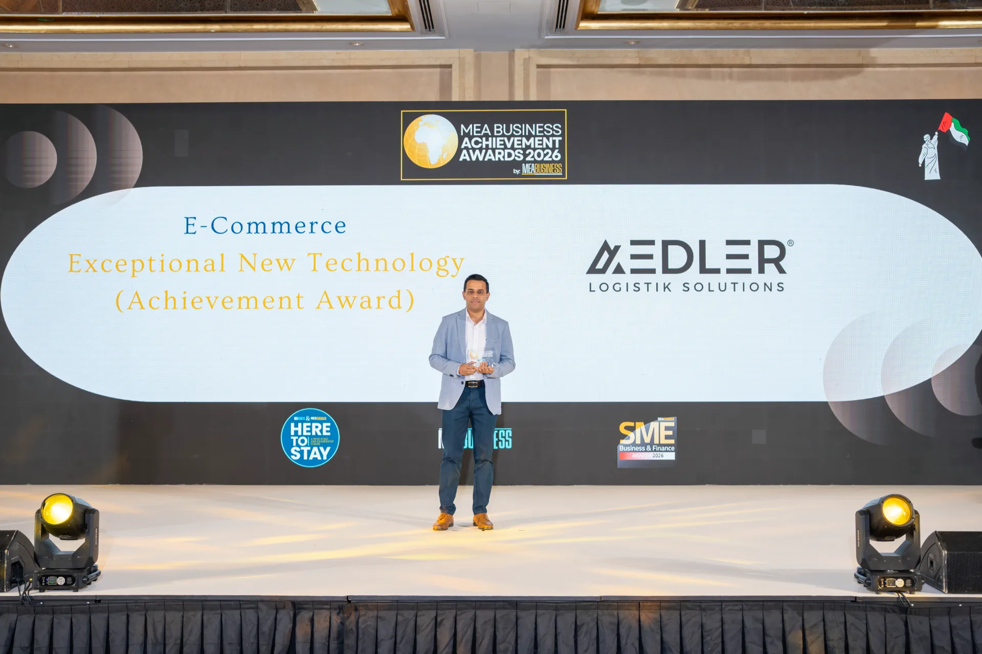 AEDLER representative holding the E-Commerce Exceptional New Technology award at the MEA Business Achievement Awards 2026