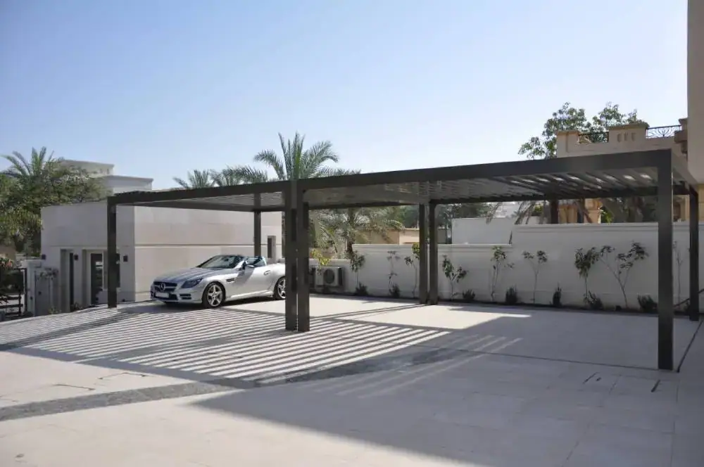 Convertible parked on a villa driveway above an invisible underground car park in Emirates Hills, Dubai