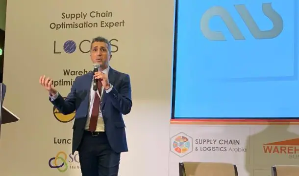 ALS speaker presenting on future warehouses at Supply Chain & Logistics Arabia, with the ALS logo on screen