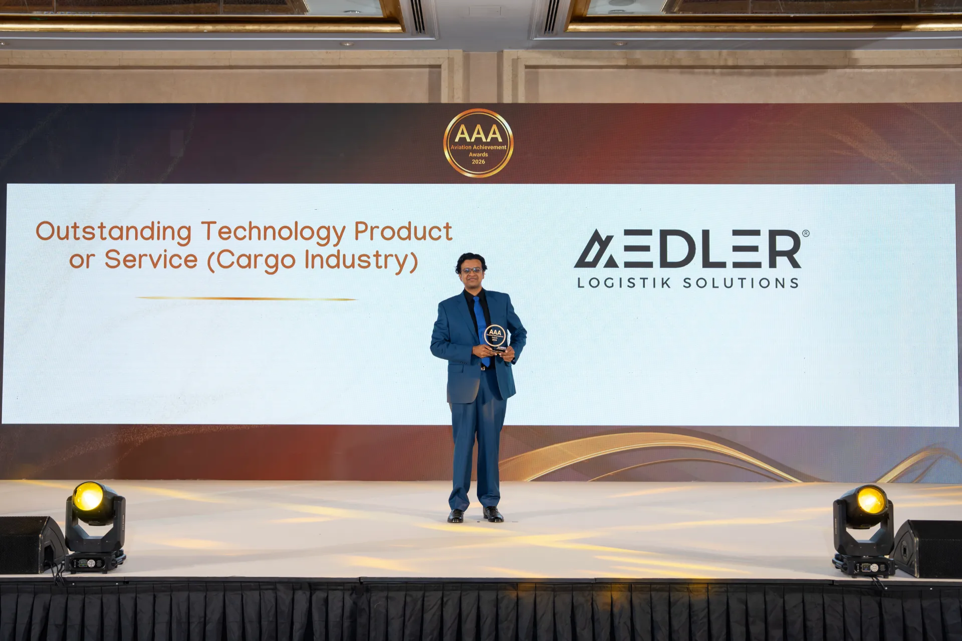 AEDLER representative holding the Outstanding Technology Product or Service award at the Aviation Achievement Awards 2026
